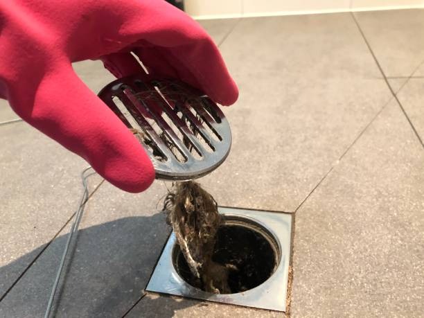 How Hair and Soap Residue Block Bathroom Drains